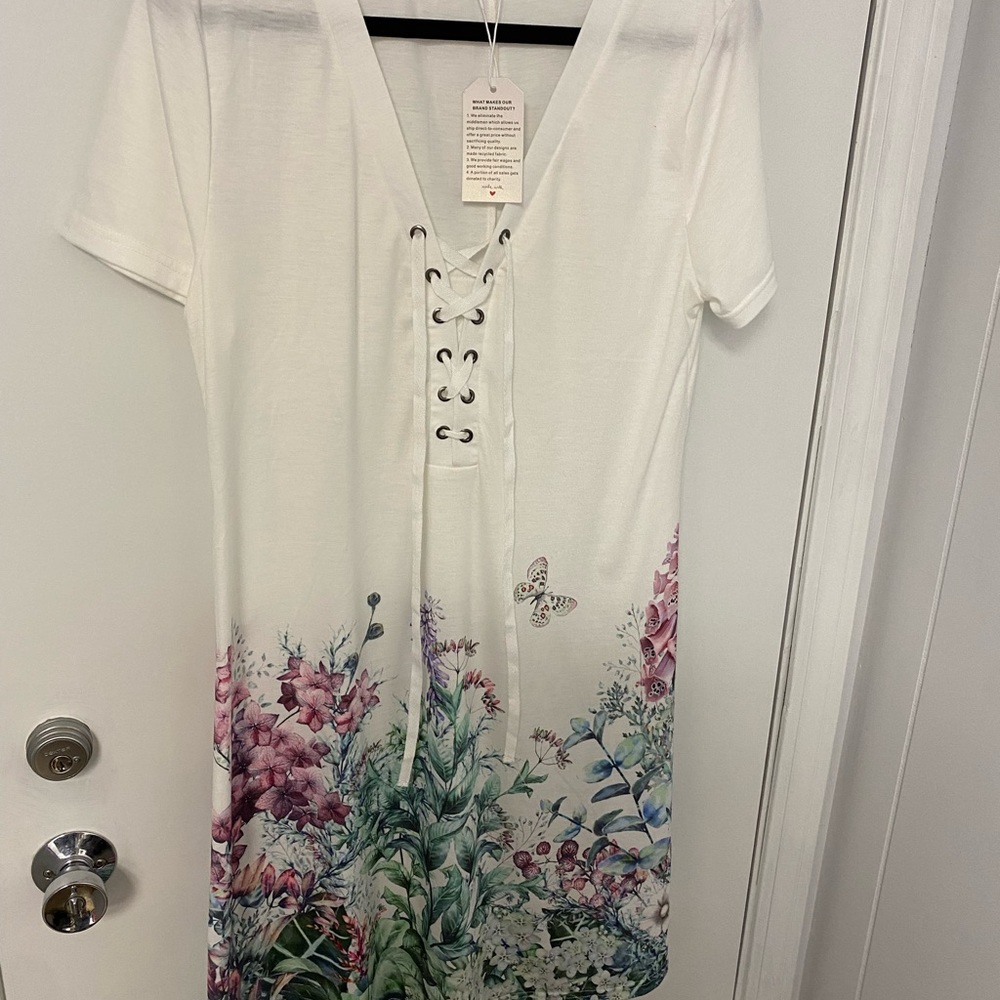 White casual dress or beach cover up. Comfortable light weight stylish!